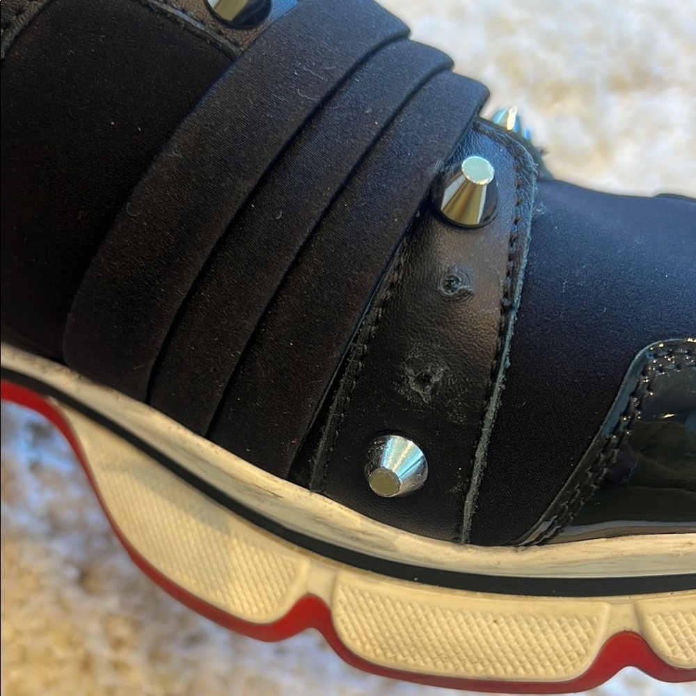 Authentic Christian Louboutin Black and Silver Studded Sneakers - Picture 3 of 11